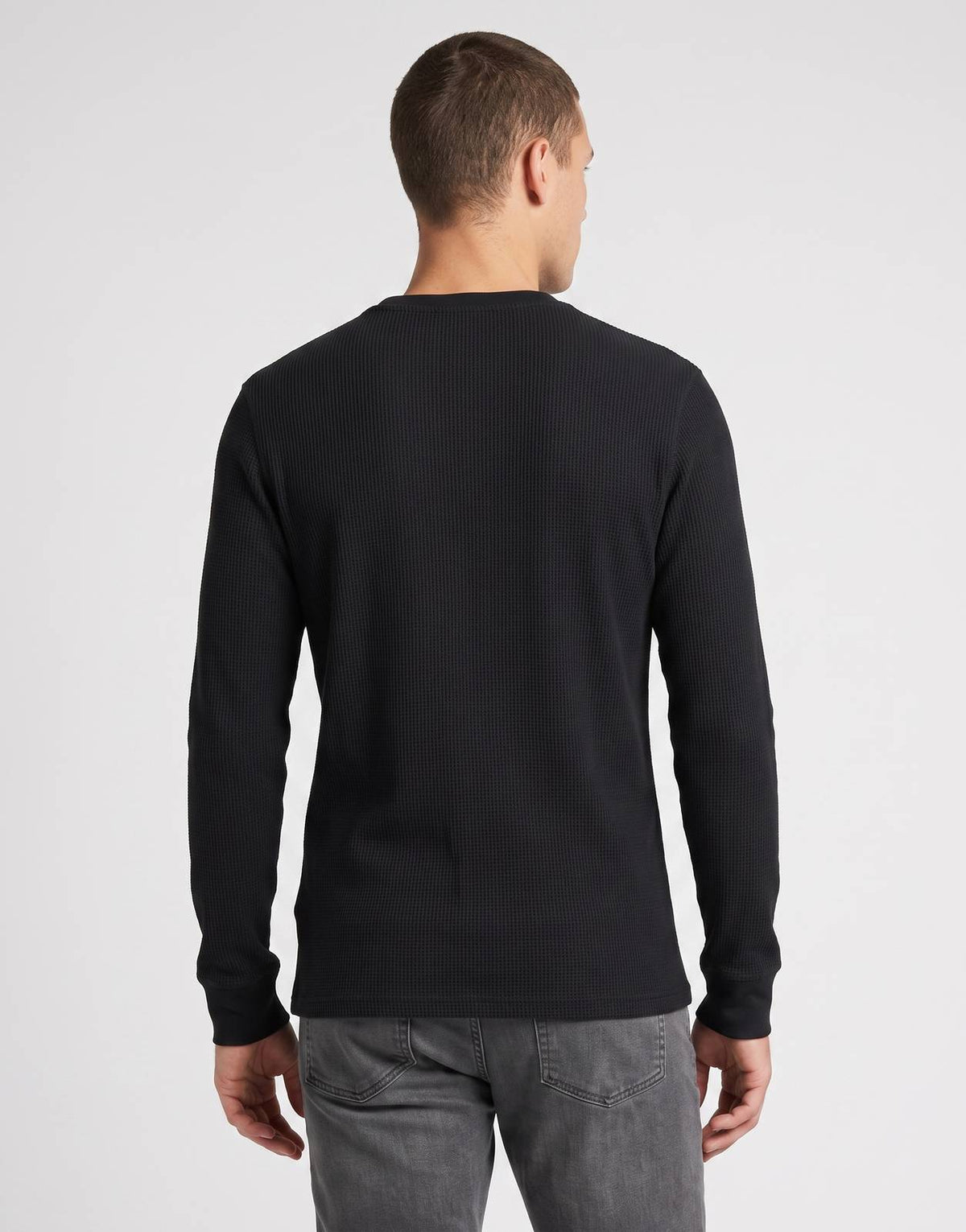 Ben Sherman men's black waffle knit Henley top, featuring a ribbed texture and long sleeves, shown from the back.