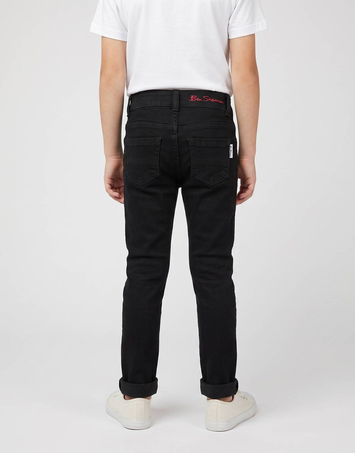 Back view of Ben Sherman Kids black denim jeans, featuring a classic five-pocket style and subtle branding on the waistband.