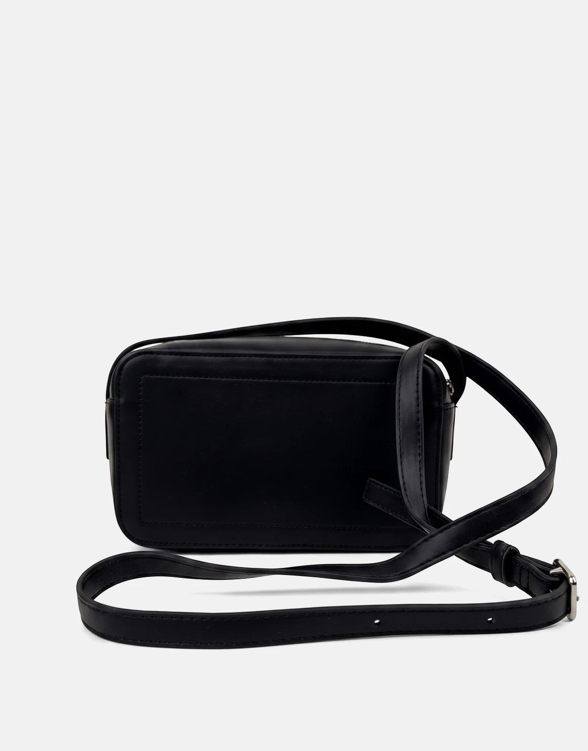 A black Calvin Klein Bold CK camera bag, made of smooth material, displayed from a side-rear view with its adjustable strap