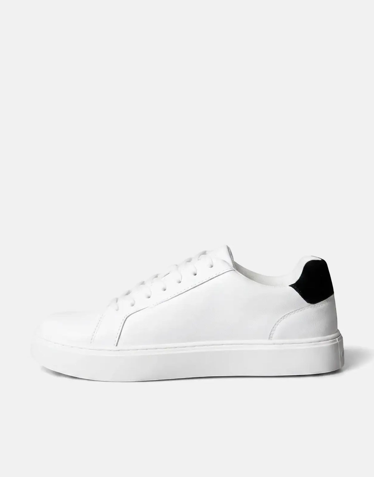 White Calvin Klein Classic Cupsole sneaker made of leather, shown in a clean side profile view.