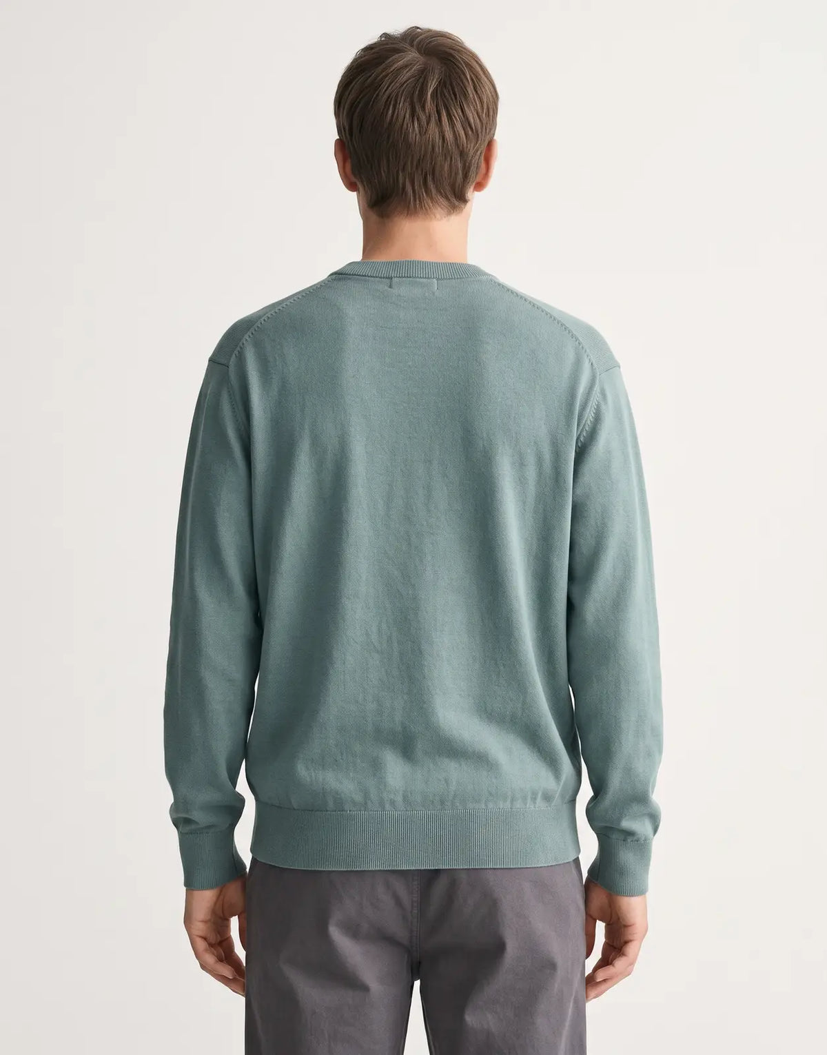 Back view of a Calvin Klein EU Cotton Relaxed Green Sweatshirt, showcasing its soft cotton fabric and relaxed fit.