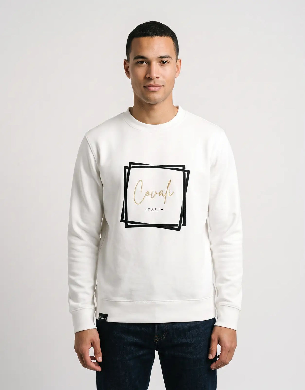 White Covali Oro Sweatshirt featuring a gold 'Covali ITALIA' script logo framed in a black square on the front. Long-sleeved