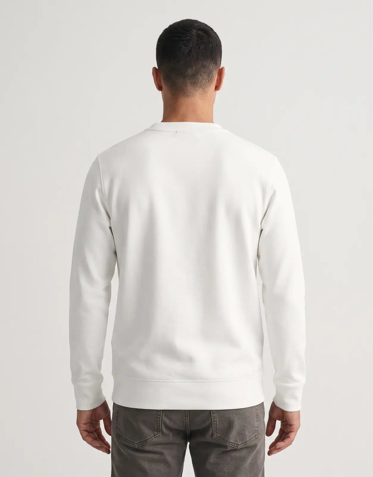 Covali Oro white sweatshirt in a classic crew neck design with long sleeves and ribbed cuffs, displayed from the back.