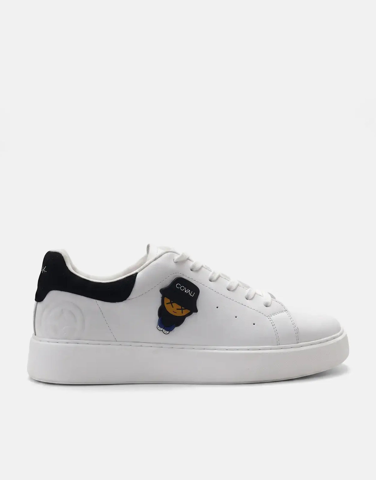 Covali Tipo low-top sneaker in white with black heel detail and unique character patch, shown from the side.