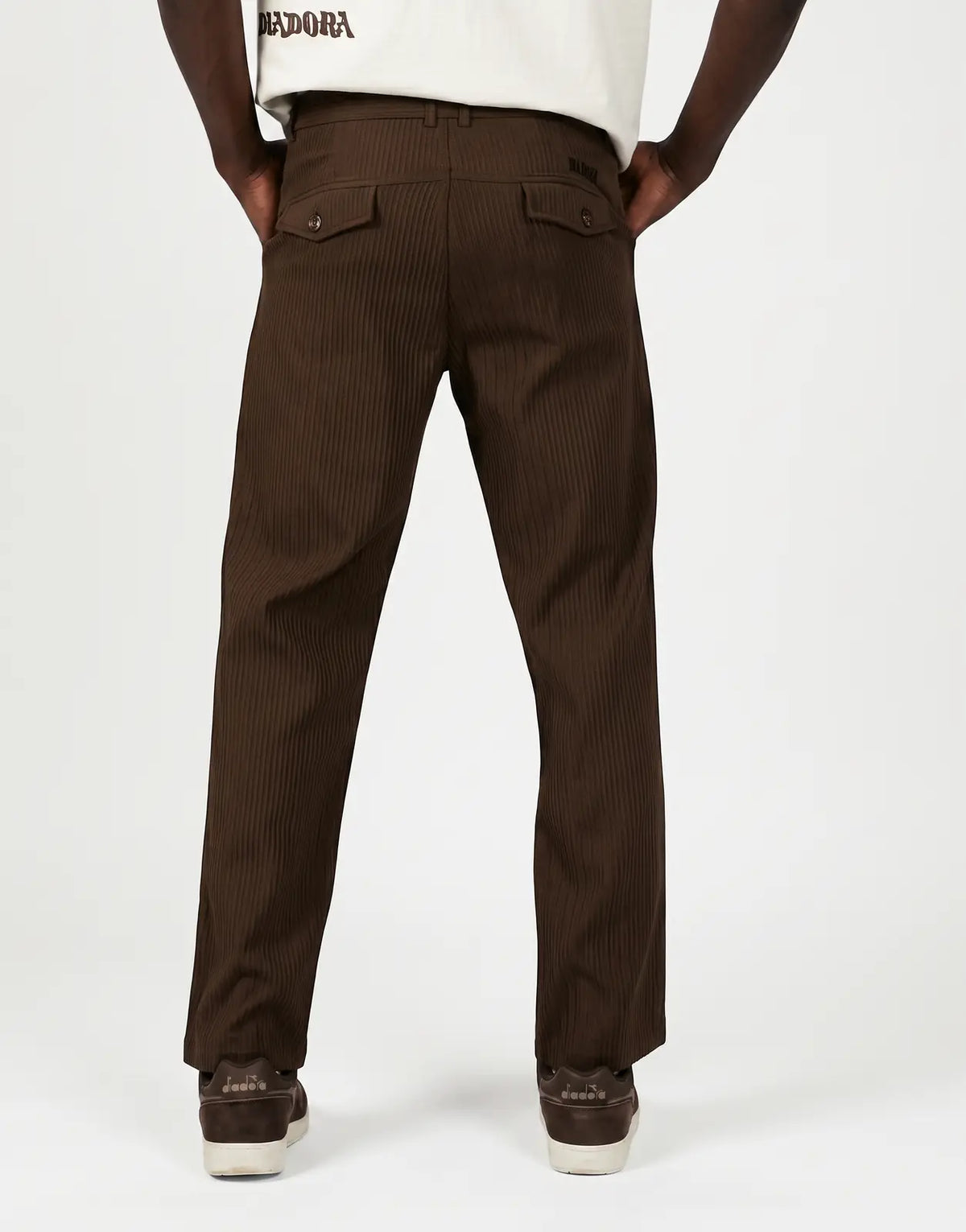 Diadora Asher men's brown corduroy pants, featuring a ribbed texture and two buttoned back pockets, shown from the back view.
