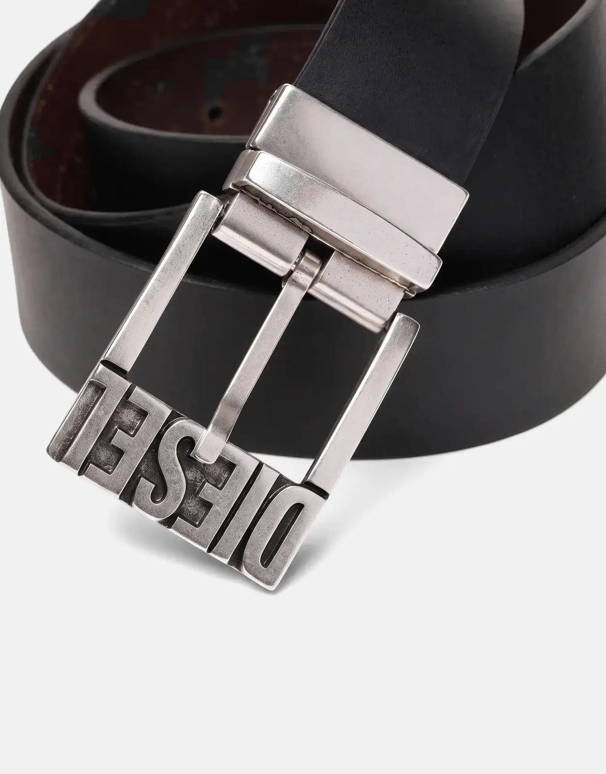 Close-up of a black Diesel B-Shift II leather belt with a prominent silver buckle featuring the Diesel logo.