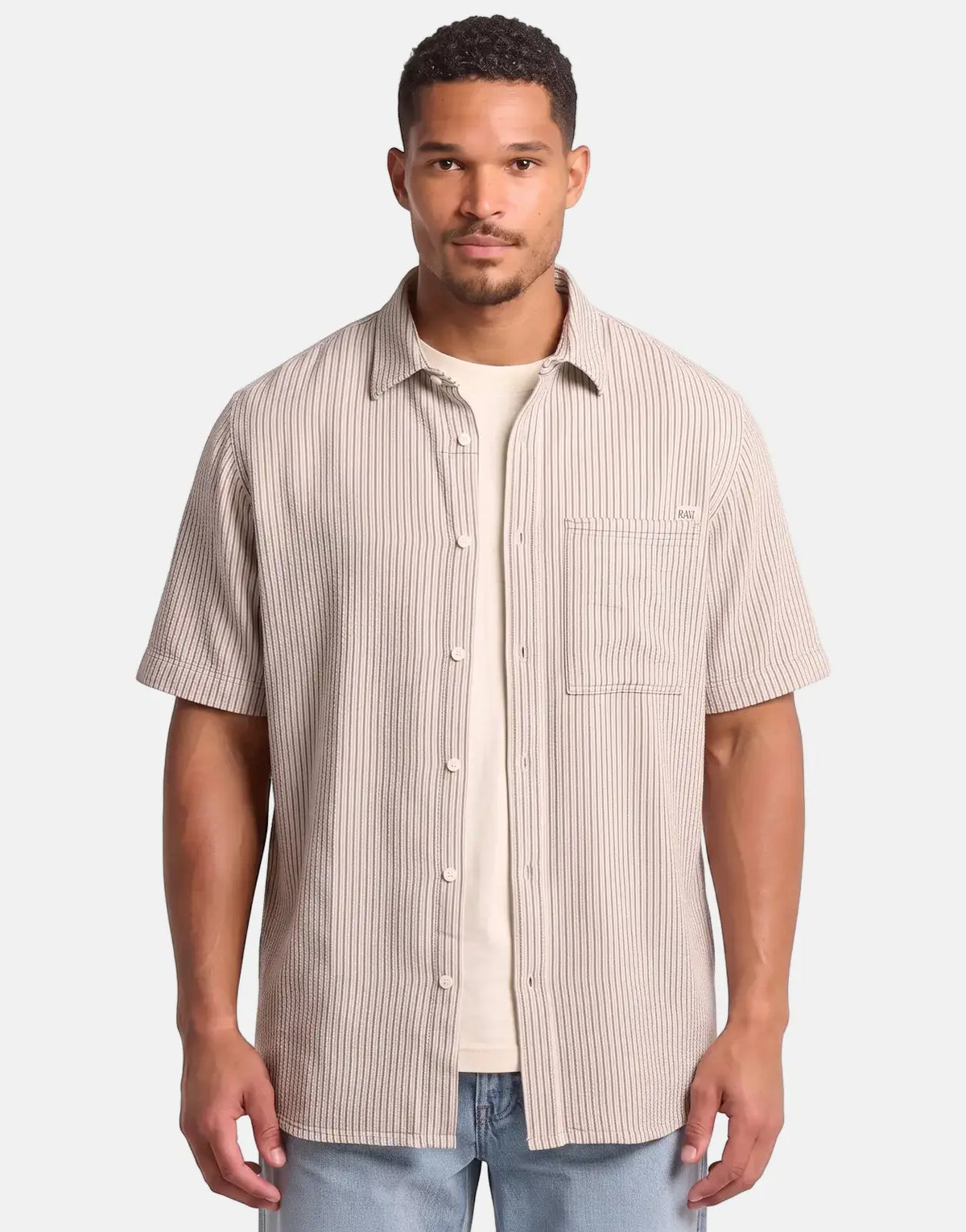 Male model wearing a G-Star RAW One Pocket Regular Rank Blue Slim Stripe Shirt, a short-sleeved casual shirt with light