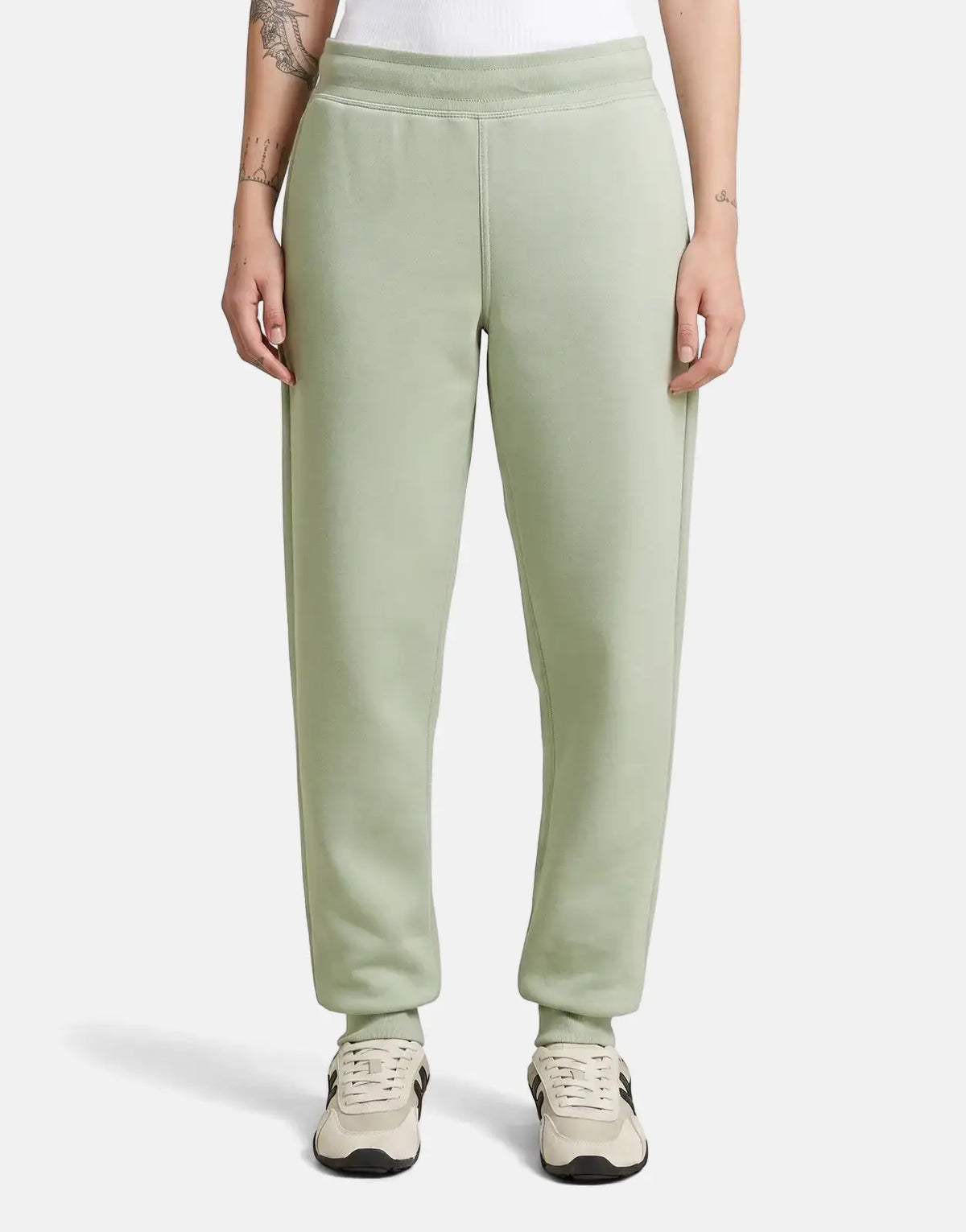 G-Star RAW Premium Core 2.0 Pale Green Sweatpants, featuring a ribbed waistband and cuffs, worn by a model standing.