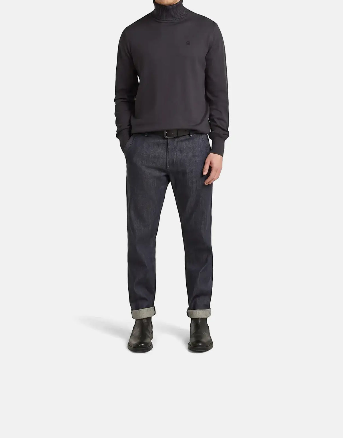 G-Star RAW Regular Fit Asfalt Sweatshirt in dark grey, shown on a male model paired with dark blue jeans and black boots.
