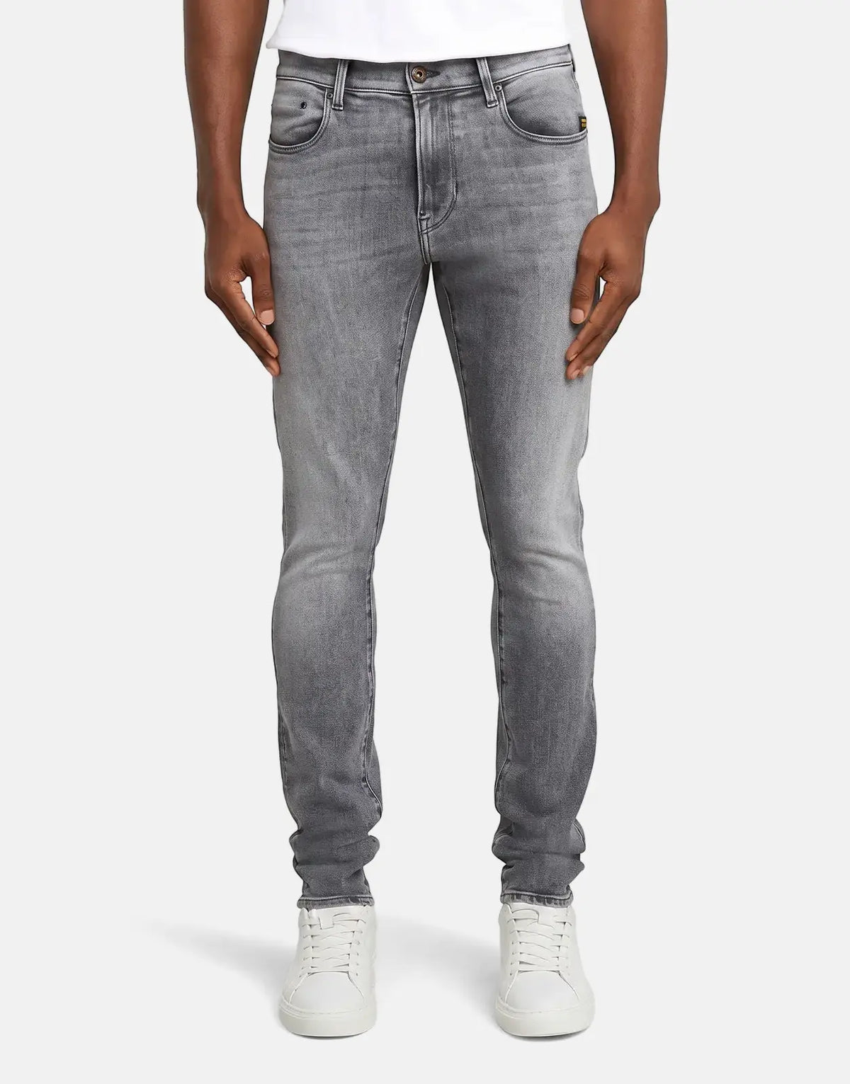 Men's G-Star RAW Revend FWD skinny jeans in faded shadow grey, showcasing a fitted style with distressed details and white