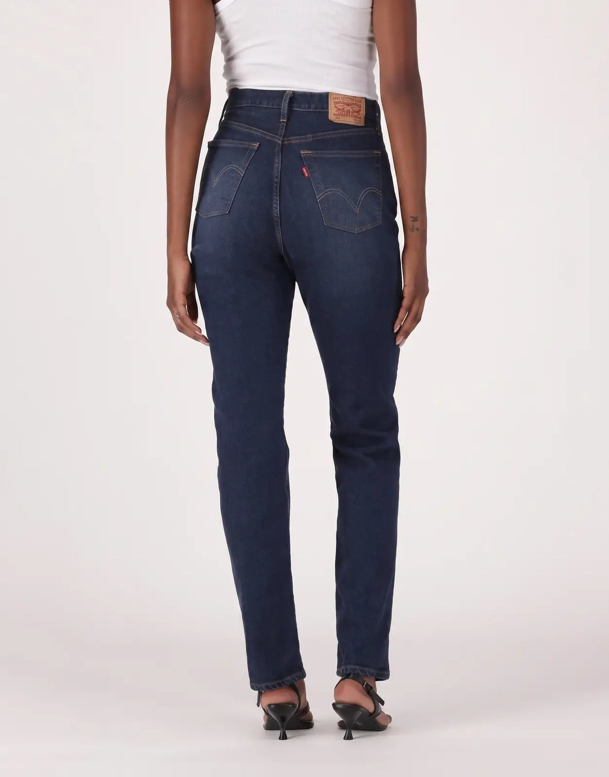 Dark blue Levis 501 Ladies Time Take jeans, presented from the back view on a model, showcasing the classic denim wash and