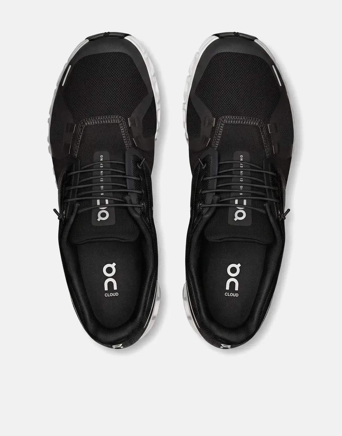 A top-down view of a pair of black and white On Men's Cloud 6 running sneakers with mesh uppers.
