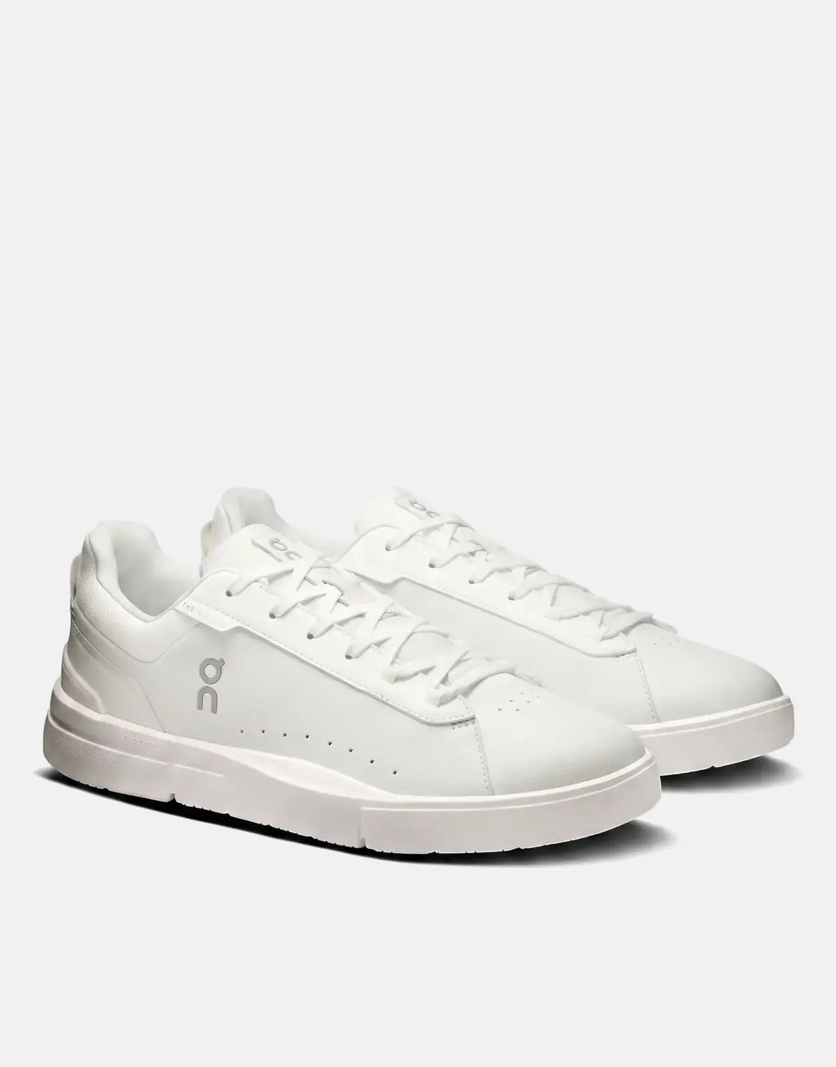 A pair of white On Men's Roger Advantage sneakers, crafted from synthetic leather, shown from a slightly elevated angle.