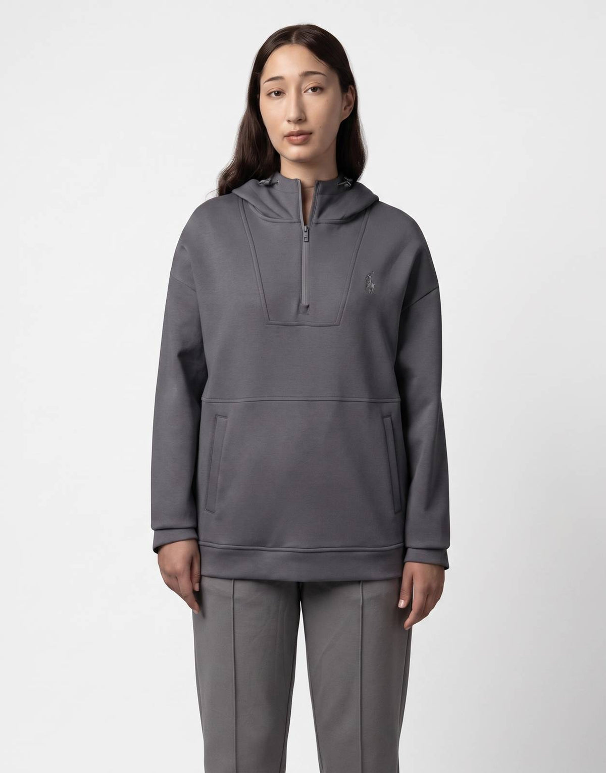 Polo Robyn LS Gunmetal Track Top, a dark grey long-sleeve hooded quarter-zip top with a subtle logo on the chest.