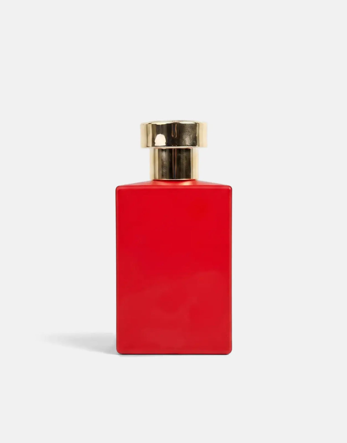Pure Premium Ginger Musk Perfume in a red rectangular bottle with a shiny gold cap, viewed centrally.