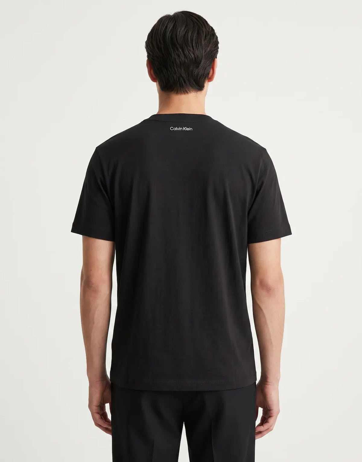 Calvin Klein 20s March Graphic Seasonal Fashion Black T-Shirt for men, featuring a classic crew neck and short sleeves,