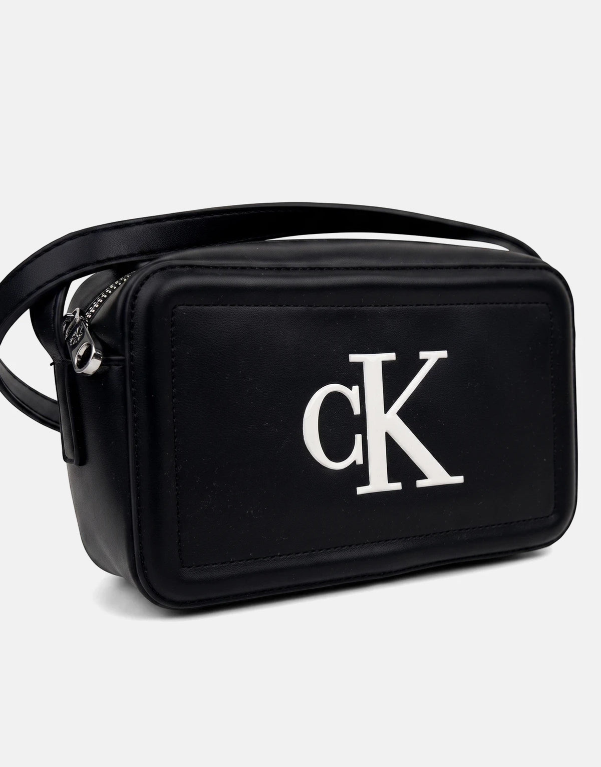 Black Calvin Klein Bold CK camera bag with white logo and silver zipper hardware, shown from an angled front view.