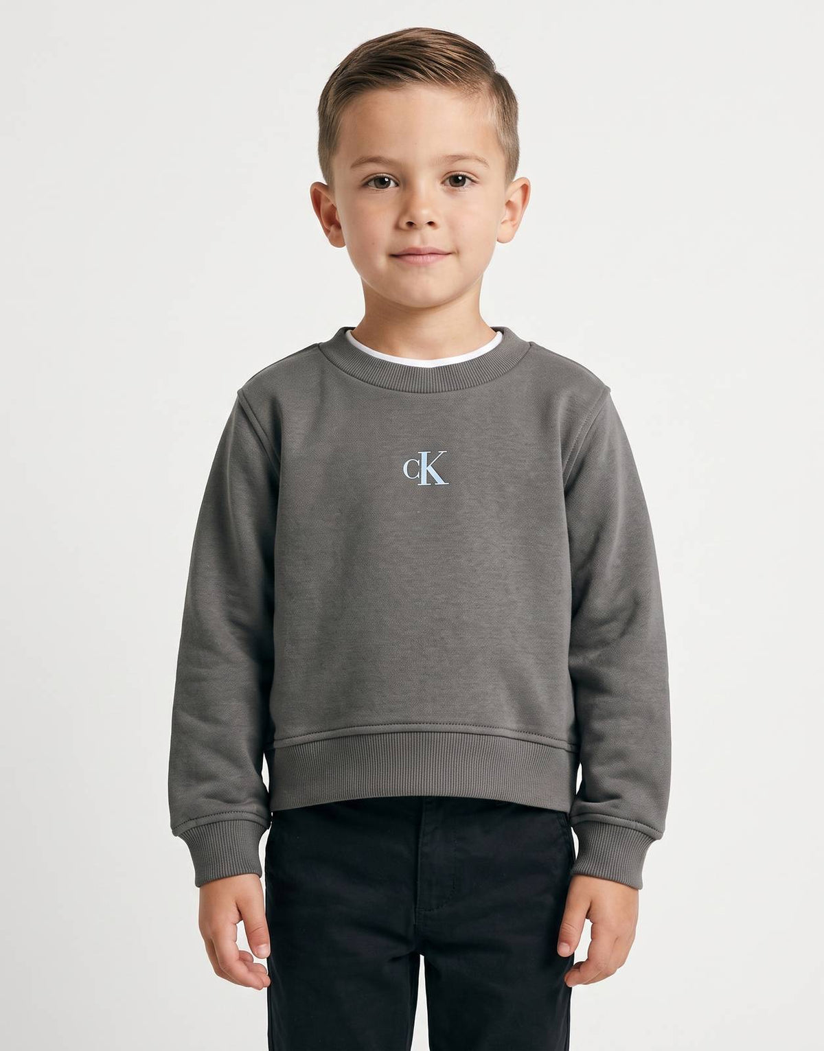 Dark gray Calvin Klein Kids long-sleeved fleece sweatshirt with a light blue 'CK' logo embroidered on the chest, displayed