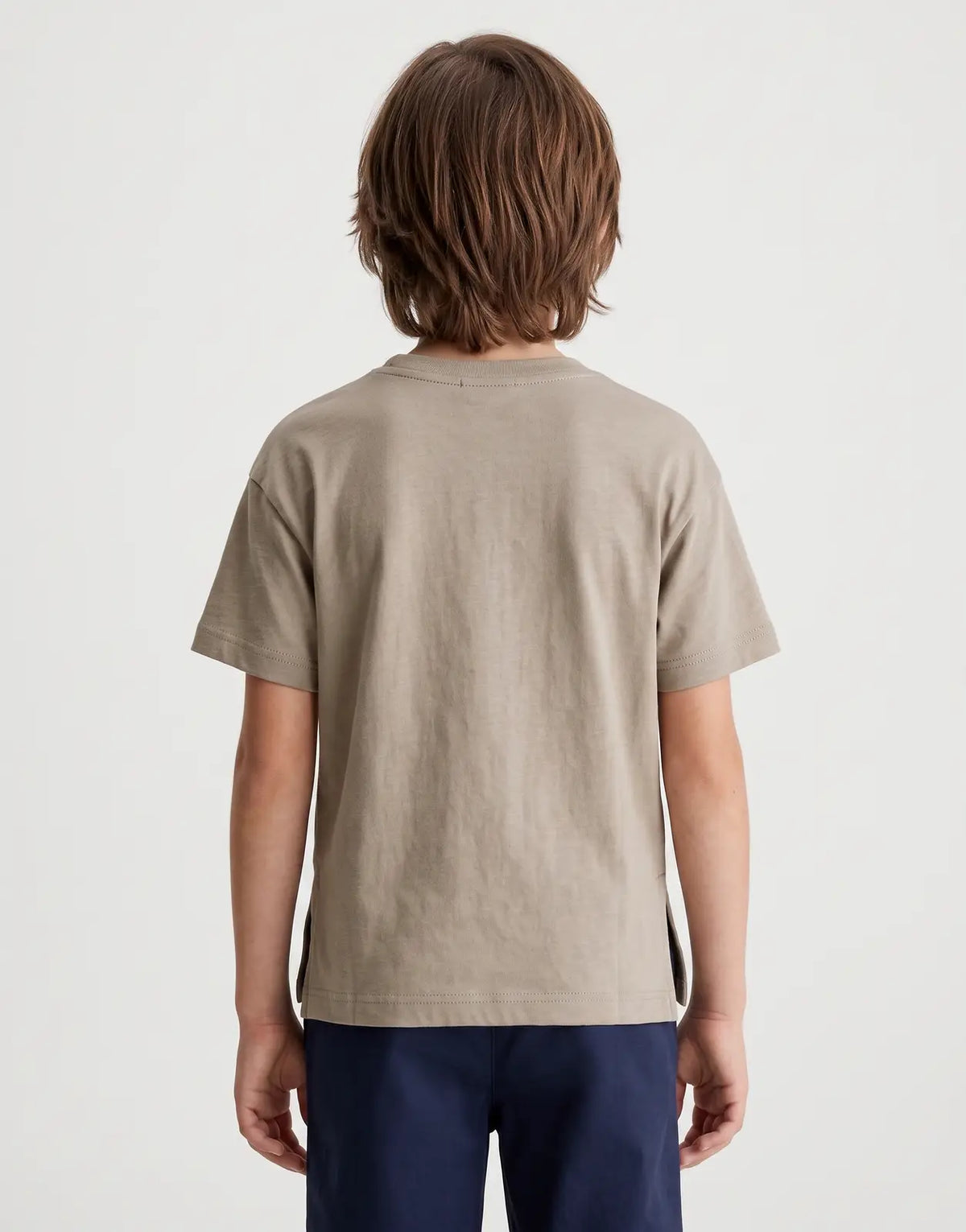 Calvin Klein Kids Monologo Brown T-Shirt shown from the back, neutral beige-brown color with short sleeves.