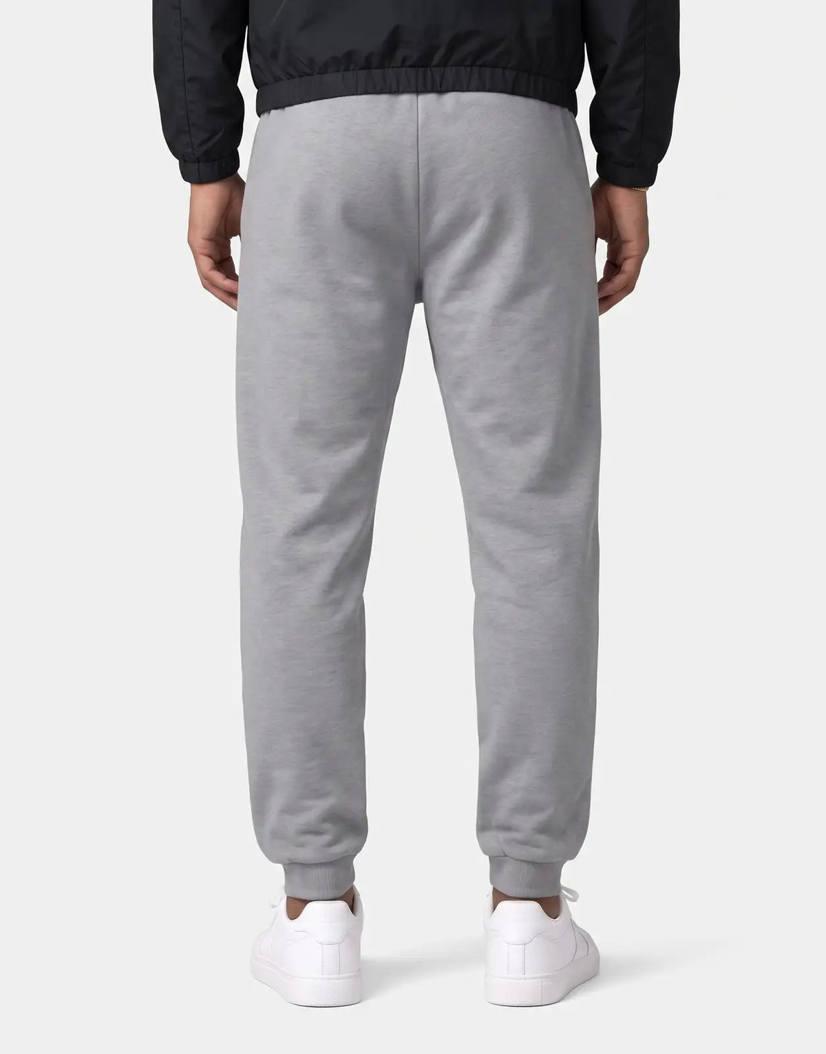 Back view of Covali Milano-Sp sweatpants in heather gray fleece with elastic waistband and ribbed cuffs.