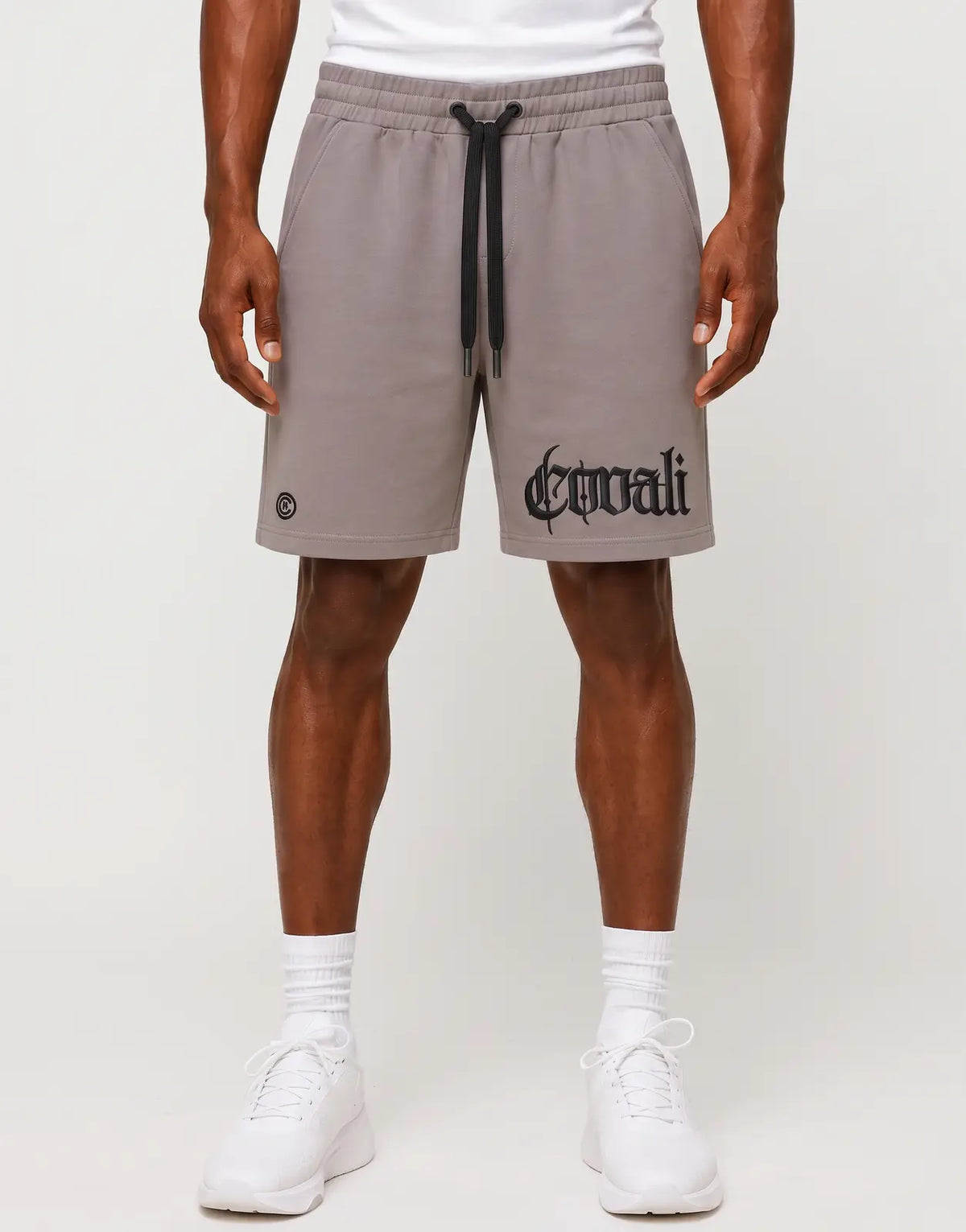 Covali Punto Sand Shorts for men, featuring a comfortable fit, black drawstrings, and unique gothic text branding on the leg.