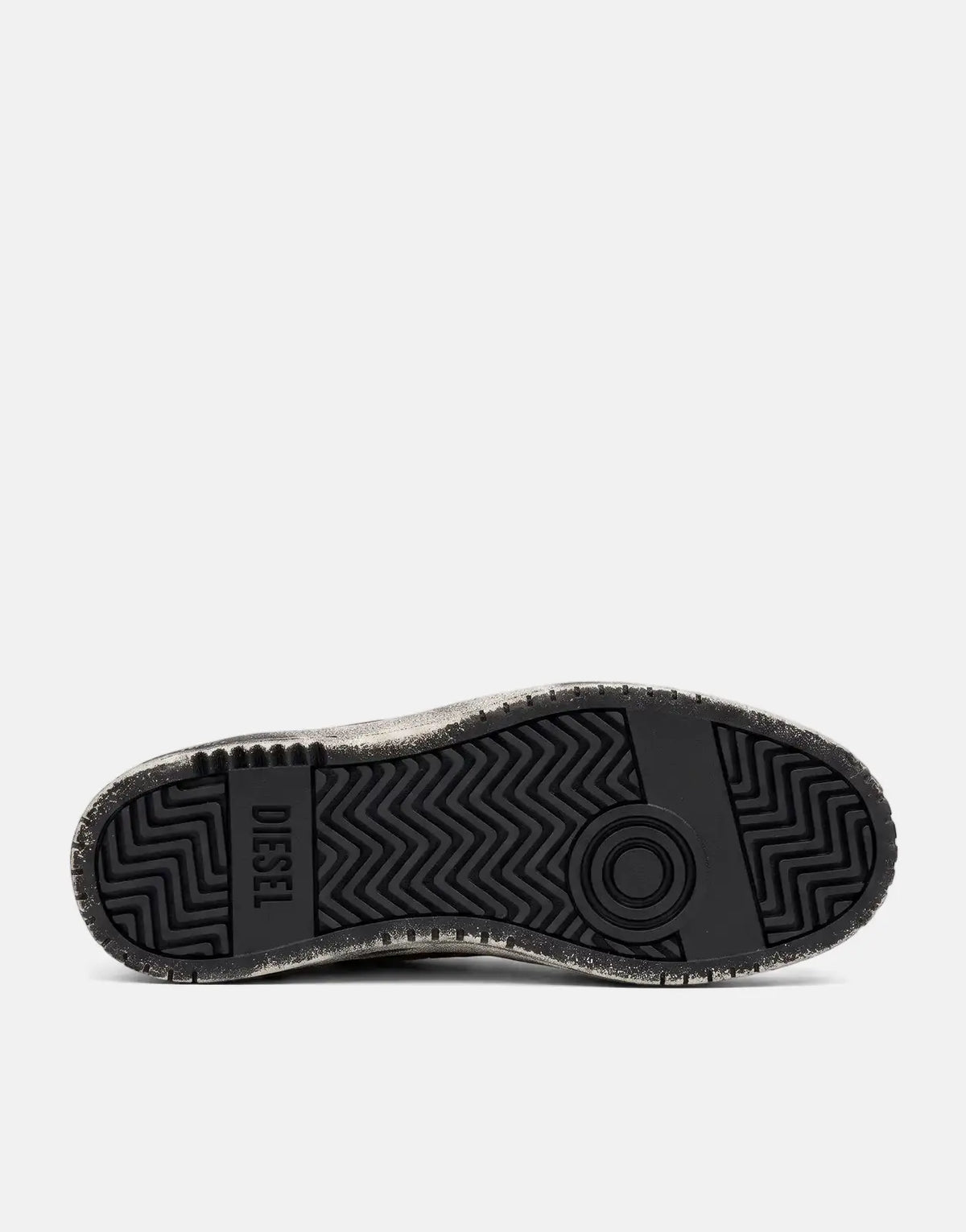 Black Diesel S-Ukiyo V2 Low sneaker sole, showcasing the detailed rubber tread pattern from a bottom view.