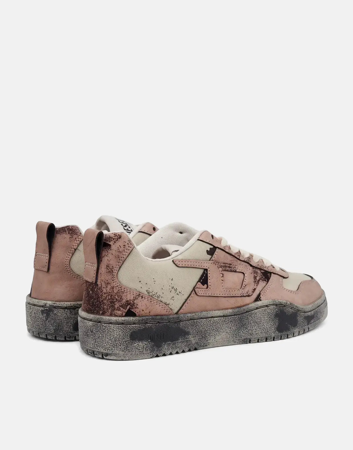 Pair of Diesel S-Ukiyo V2 Low Sneakers in distressed pinkish-beige and light canvas with chunky dark soles, side view.