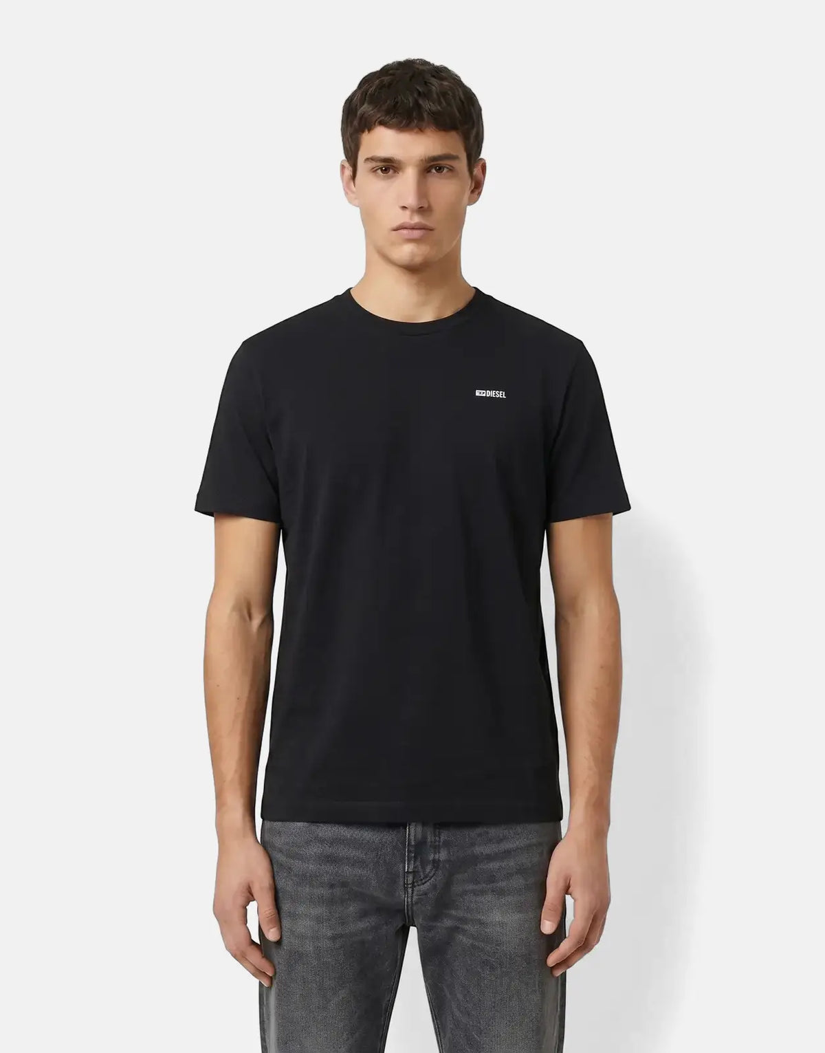 Black Diesel T-Adjust Met T-Shirt for men, styled with grey jeans, worn by a model in a front view.