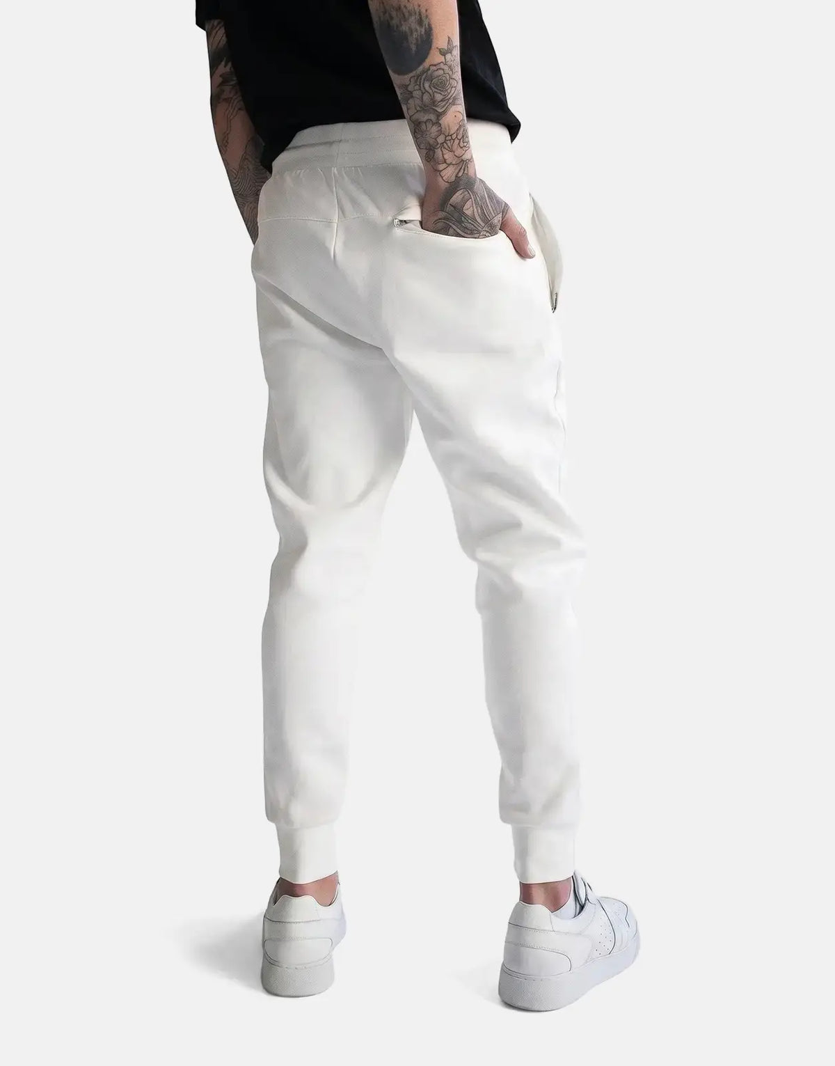 Off-white Fade Essential Sweatpants on a person from the back, showcasing the comfortable fit and subtle details of the