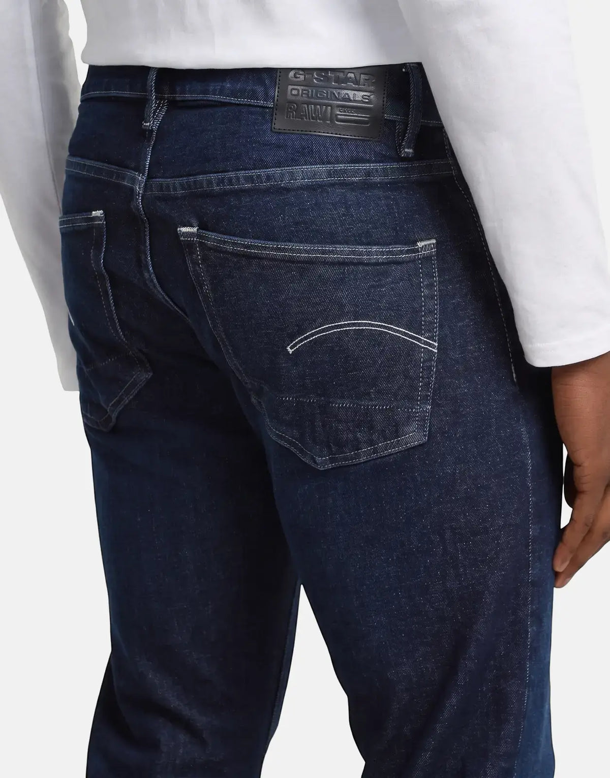 G-Star RAW 3301 Worn in Deep Marine dark blue denim jeans, shown from the back on a model, highlighting the pockets and