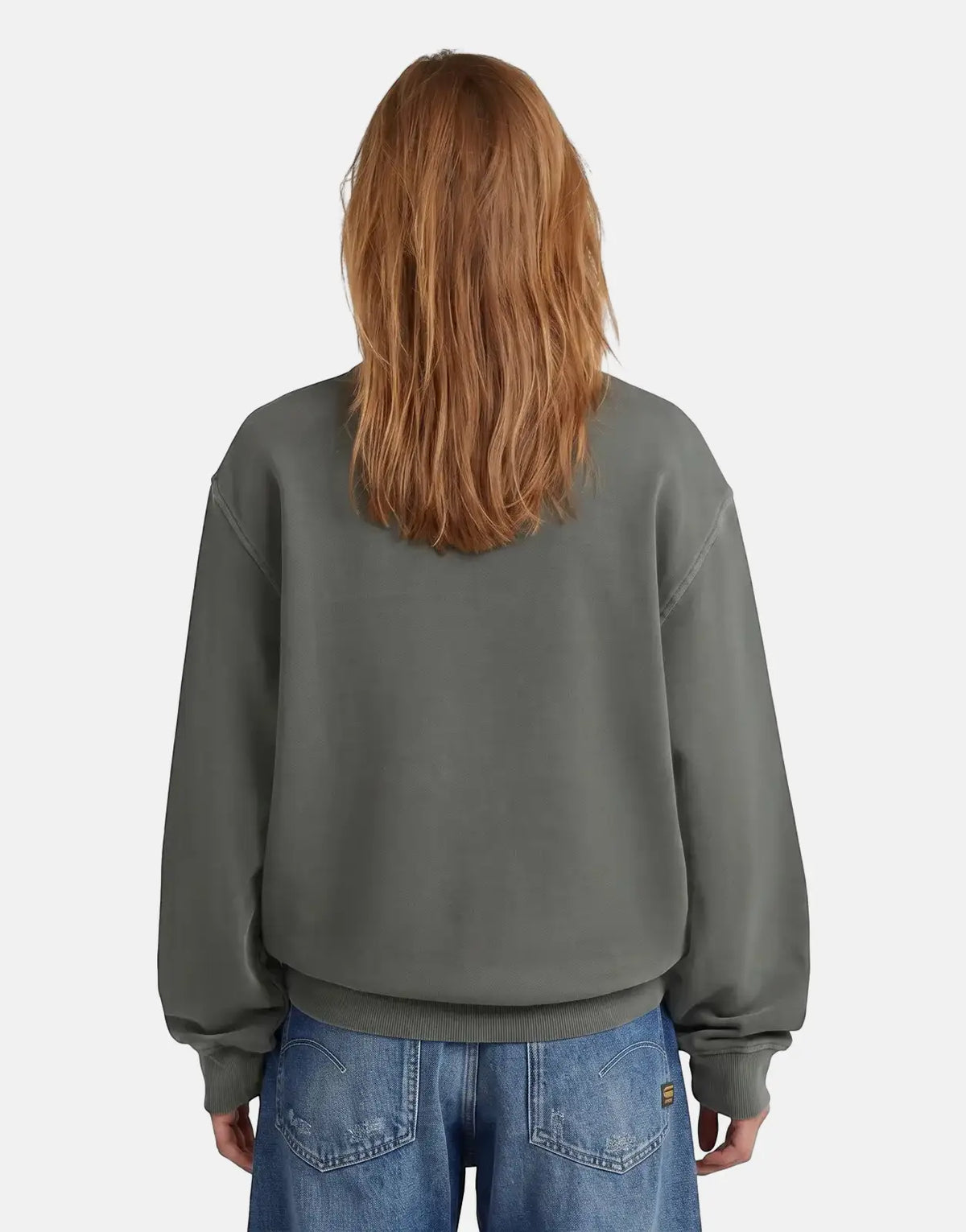 Back view of a person wearing a dark grey G-Star RAW Modern Basic relaxed fit sweatshirt and blue jeans.