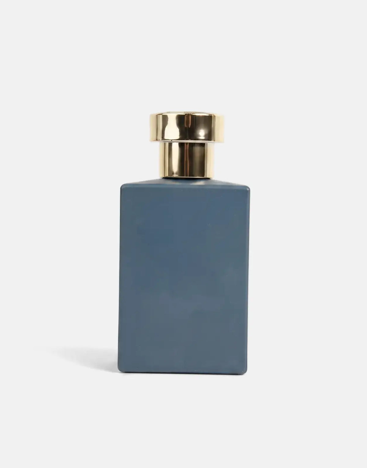Pure Premium Assassin Perfume in a matte blue rectangular bottle with a shiny gold cap, shown front view.