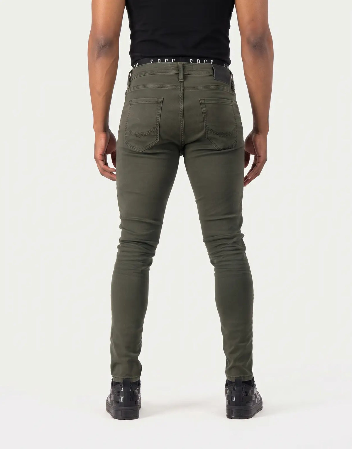 SPCC Rodan Redrafted Fatigue Jeans for men in olive green, featuring a skinny fit and rear pocket details, viewed from the